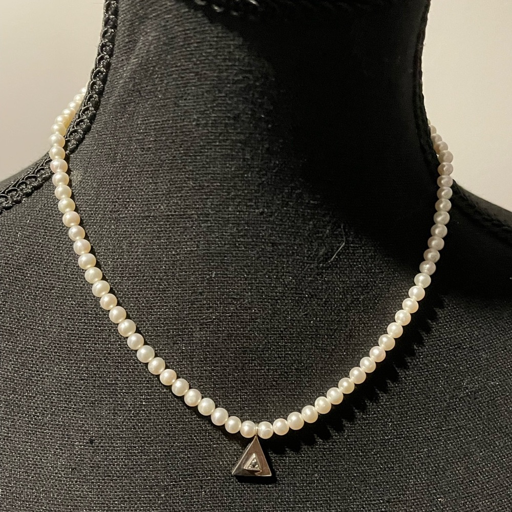 Beautiful delicate pearl necklace with silver triangle. Great Xmas gift idea!